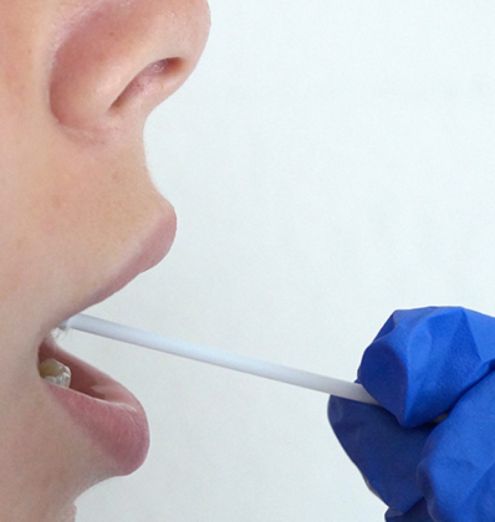 the doctor takes a test for coronavirus from the girls mouth | Schools Week