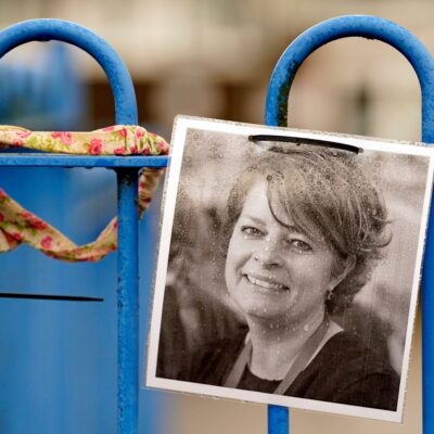 A photograph of Ruth Perry attached to the fence outside John Rankin Schools in Newbury Berkshire where headteacher Flora Cooper is planning to refuse entry to Ofsted inspectors following the death of Ms Perry who was head at nearby Caversham Primary S | Schools Week A photograph of Ruth Perry attached to the fence outside John Rankin School